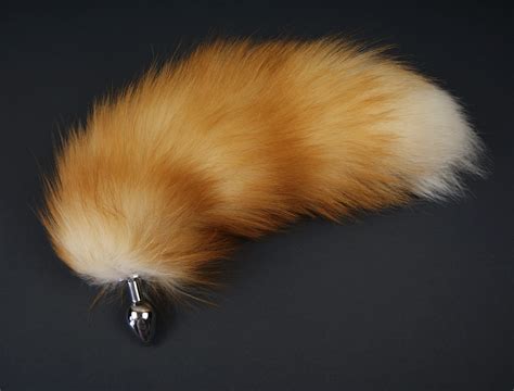Tail buttplug - With fox tail butt plugs available in different shapes and sizes for people of any experience, the beautiful tails can be found in many different lengths and colors. Choose firm, thick steel for unrelenting pressure and optional temperature play or smooth, soft and flexible silicone - there are options to suit everyone.